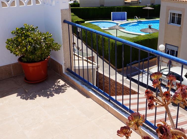 Reformed two bedroom, one bath top floor apartment with private solarium for sale in La Siesta
